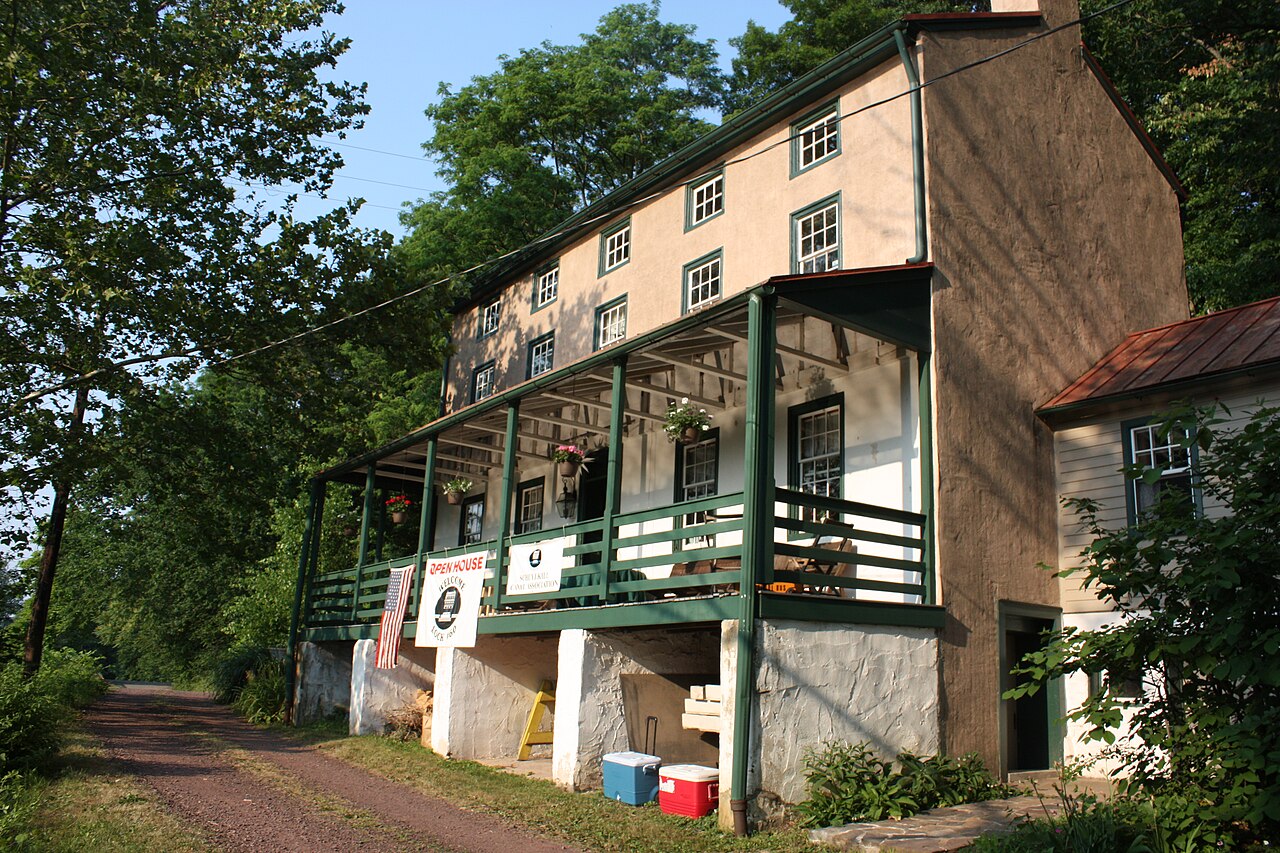The stone Lock Tender's House at Lock 60, with its green-trimmed porch