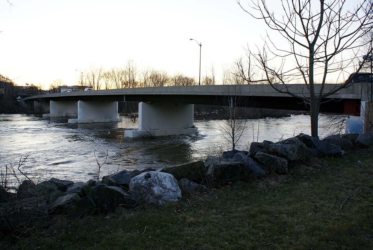 A multi-span bridge crossing the Schuylkill River near Mont Clare in late autumn
